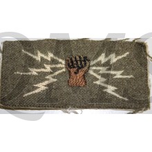 kaki wool brown hand grasping white lines of communication, white canvas backing