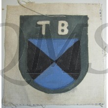 it shows the black-/blue-coloured shield with above the interwoven 'Cyrillic' characters: 'TB'. Simply a truly rarely encountered piece of eastern volunteer related insignia: one of the more harder to encounter specimen of the colourfull series!