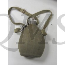 A grey/green wool covered, aluminum canteen with webbed shoulder sling with aluminum screw top
