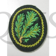 Nicely machine-embroidered on a dark-green woolen base. Nice original example in good unissued condition!