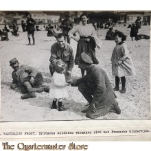 Press photo , WW1 Western front , British soldiers playing with French children 