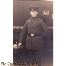 AnsichtsKarte (Mil. Postcard) Soldier posing at table 1916