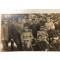 Foto groep officieren zittend voor bossen 1915