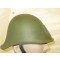 The stamped sheet steel construction M34 helmet retains almost all of it's original green paint. All liner retaining rivets are intact. The interior of the helmet is a leather liner complete with felt protection and original liner-cord.