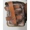 Standard issue, model 30 (1897) rear ammunition pouch as used by the Japanese army throughout the war. Pouch is approximately 17.5cm x 9.5cm x 7.5cm. Dual pocket, brown leather pouch originally would have held sixty rounds of 7.7mm ammunition, for a total