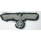 The eagle is nicely hand-embroidered using silver braid on a early style dark-green wool. The eagle is in good used and clearly cap removed condition.