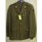 A four brass button tunic with lay down collar, integral button shoulder straps, scallop button flap breast pockets, watch fob pocket and large button flap patch pockets to the hips