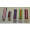 Medals badges and paperwork of Pvt R.P. Ferrie R.C.O.C. 5th Division Holland