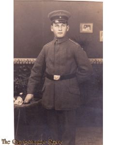 AnsichtsKarte (Mil. Postcard) Soldier posing at table 1916