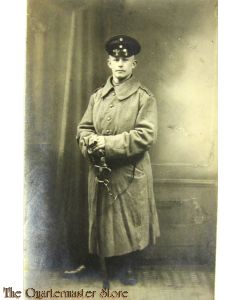 Studio portter German Soldier in greatcoat with sabre